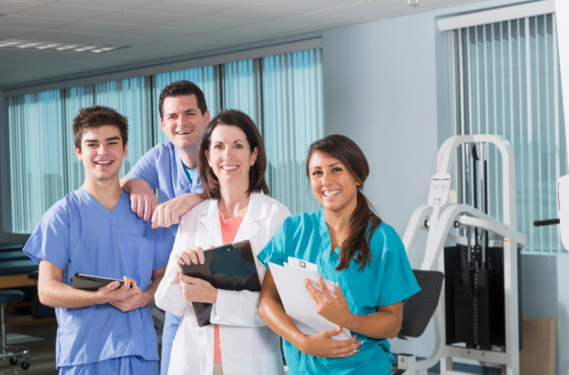 Team of physical therapists posing for a picture.