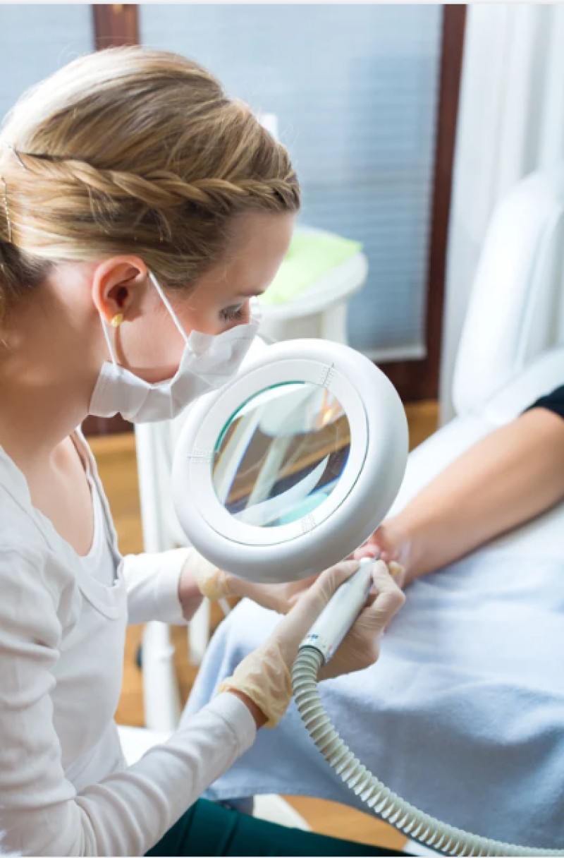 Podiatrist examining a patients foot.
