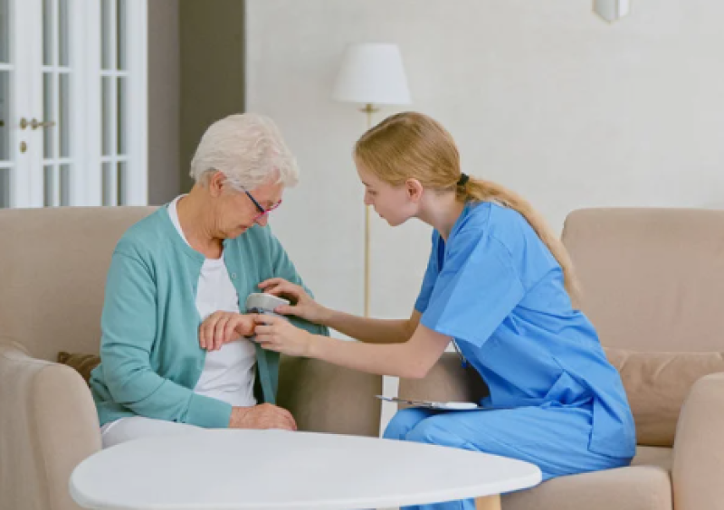 Nurse helping a resident.